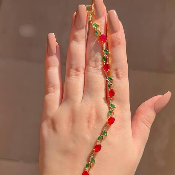Hand wearing a colorful beaded bracelet against a neutral background