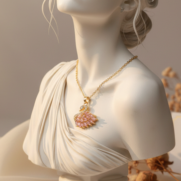 White marble bust of a woman with a necklace, placed on a neutral background with dried flowers.